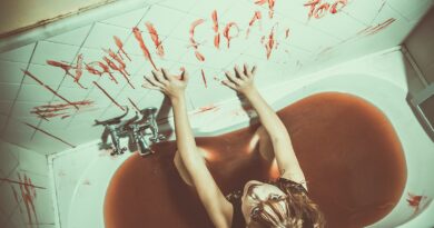 woman in bathtub with red petals