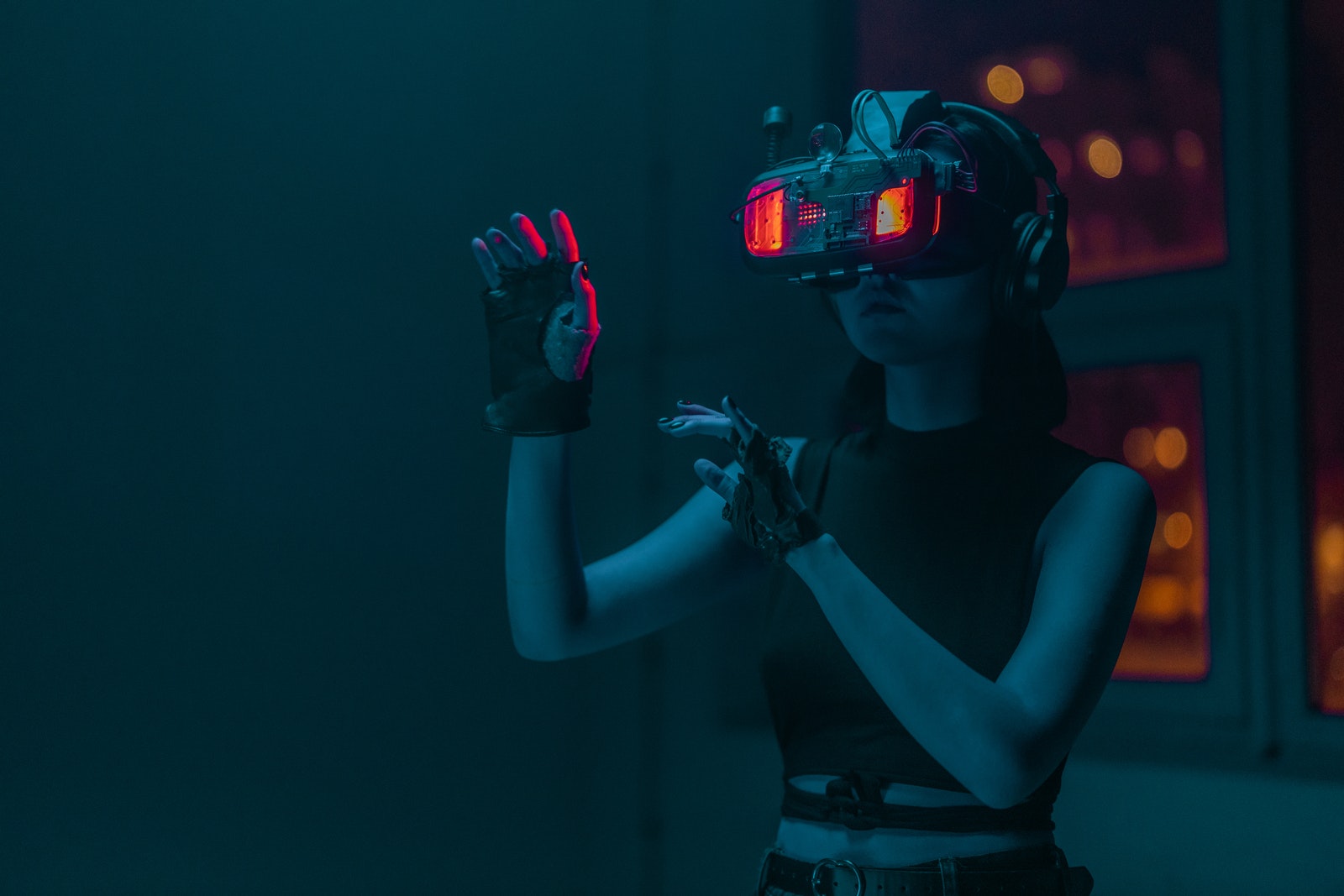 A Person Doing Hand Gestures While Wearing a Vr Goggles