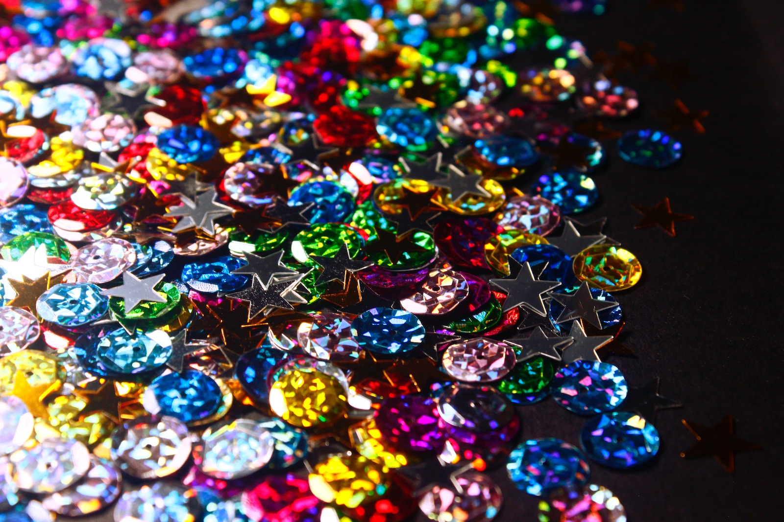 a bunch of different colored jewels on a table
